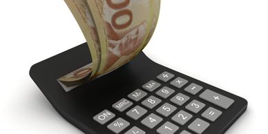 Calculator with euro banknotes flowing out.