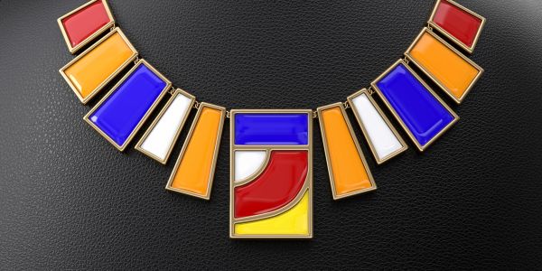 Colorful geometric necklace with red, blue, yellow, and white segments on black background.