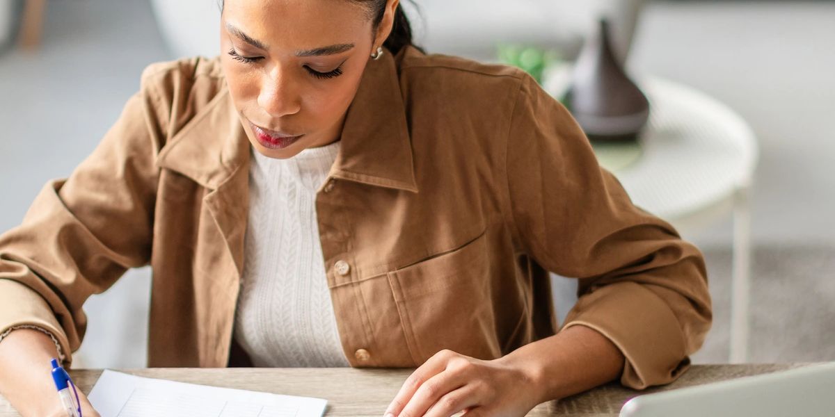 Tax documents and calculator on desk for short sale tax planning