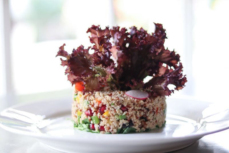Fresh quinoa salad with vibrant vegetables and crisp lettuce, perfect for a healthy meal