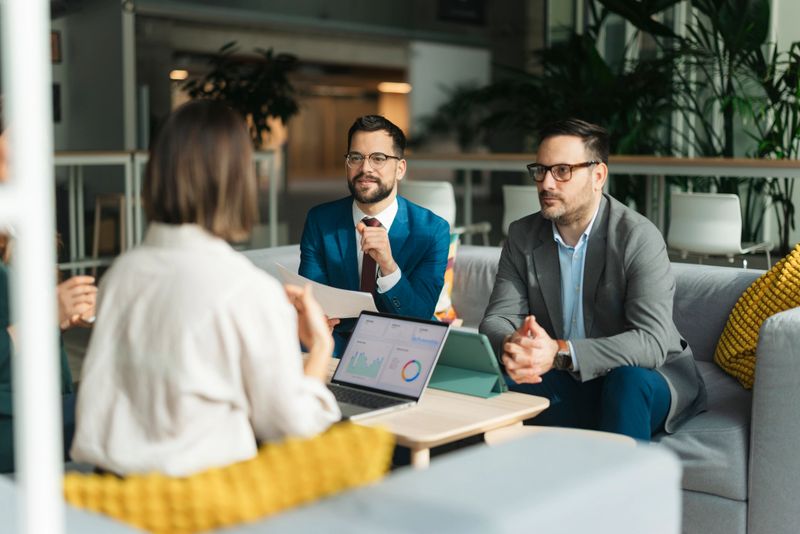 Business team analyzing data and planning strategy during a corporate meeting