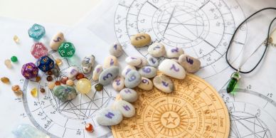 Astrology charts with healing crystals and flowers.