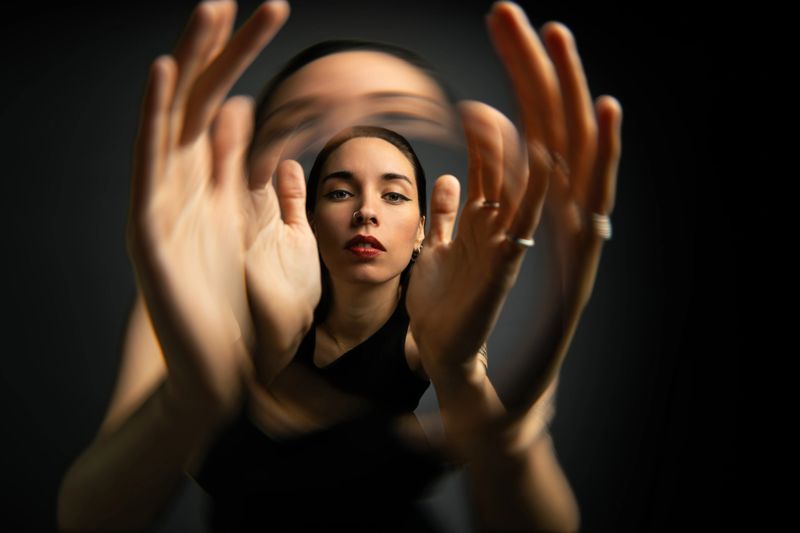 Conceptual portrait centered on perception and identity, framed by a circular distortion effect that isolates the subject’s face while blurring the surrounding motion. The composition creates a visual metaphor for self-reflection, focus, and personal awareness. Ideal for themes related to identity, mental focus, introspection, psychology, personal growth, and contemporary self-image narratives in editorial, branding, and conceptual storytelling.