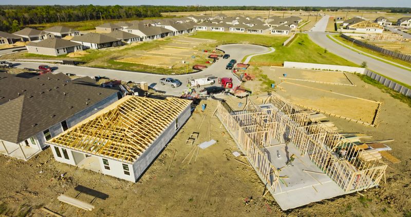 Drone shot over a residential development with homes under construction.