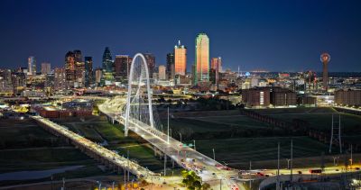 Night view of a city with a lit bridge.