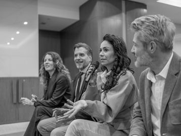 Four people in a panel discussion.