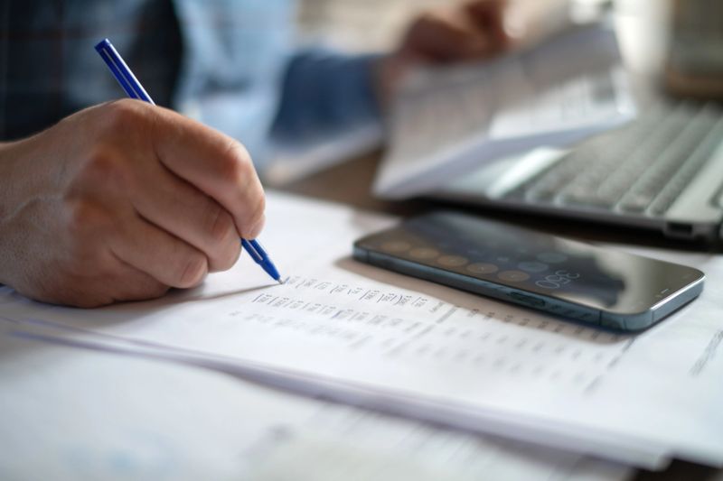 Man with financial documents indoors