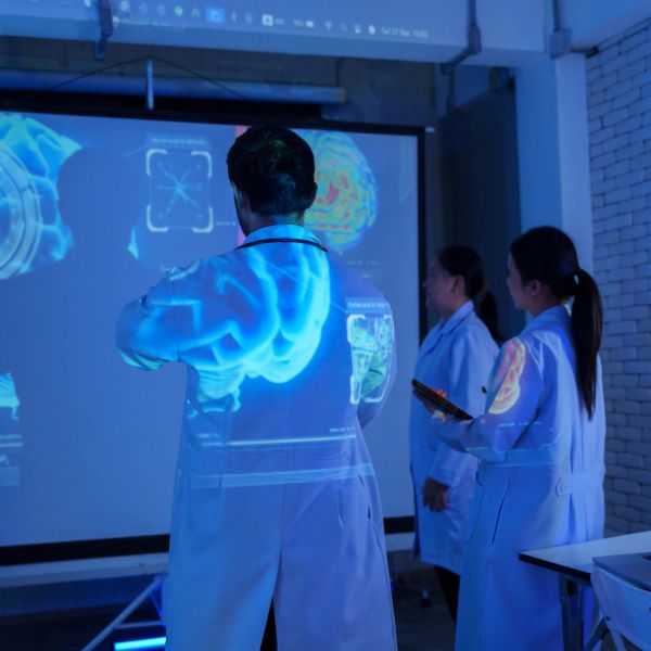 Scientists analyzing brain scan projections.