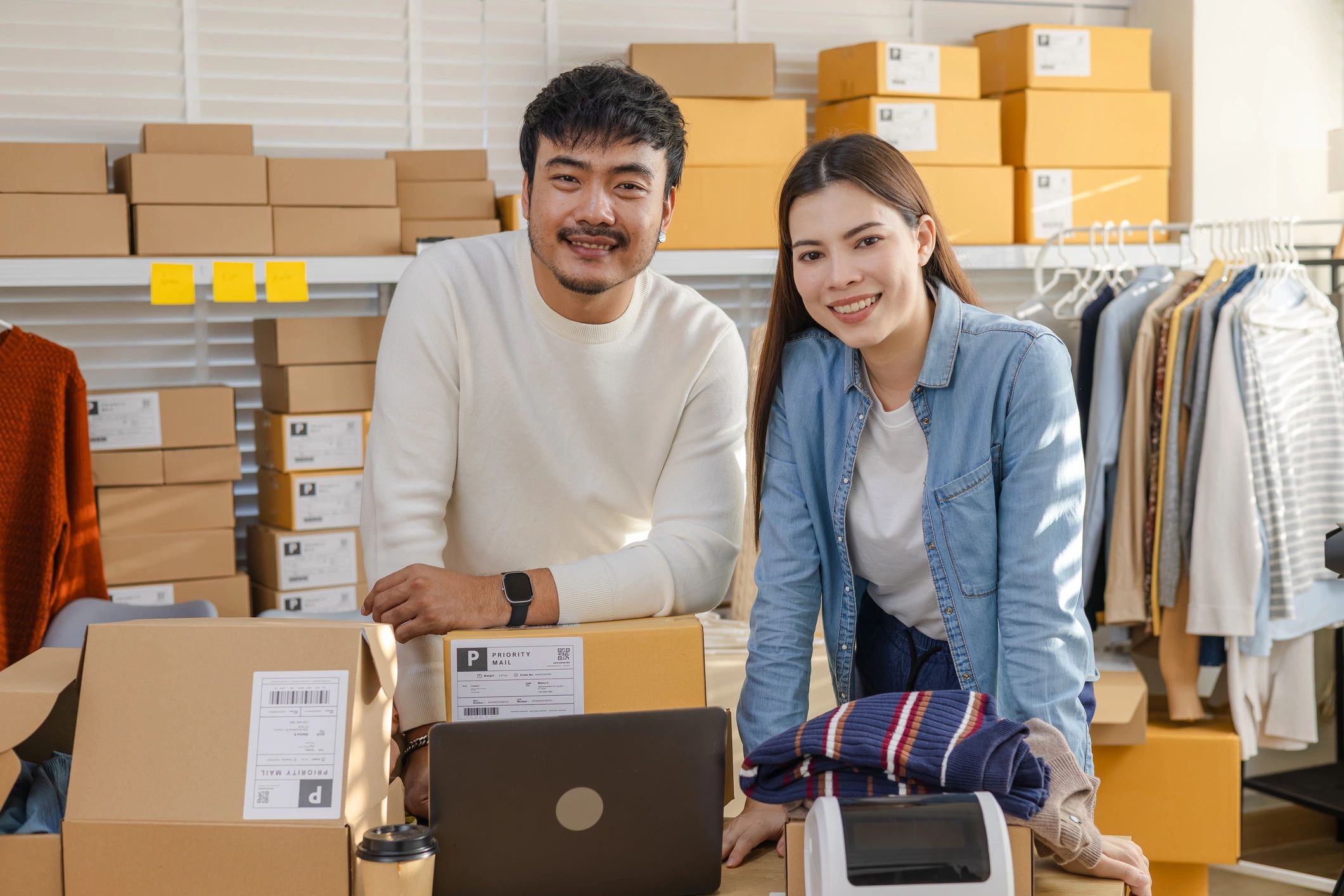 Man and woman starting a dropshipping businesss by selling products online.