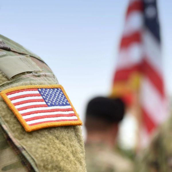 American flag patch on a military uniform shoulder.