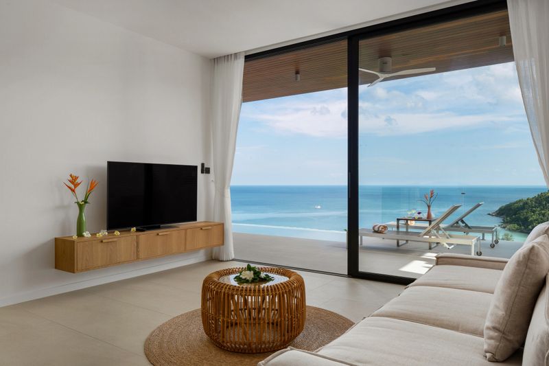 Modern living room providing stunning ocean views and comfort in a luxury tropical villa.