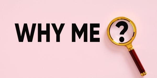 Text saying 'WHY ME' with a magnifying glass over a question mark.