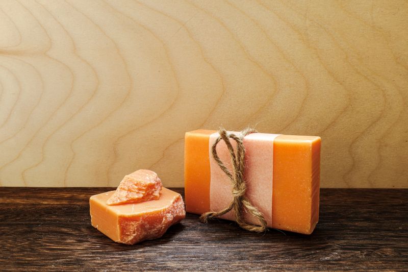 Minimal rustic composition highlighting handmade citrus soap