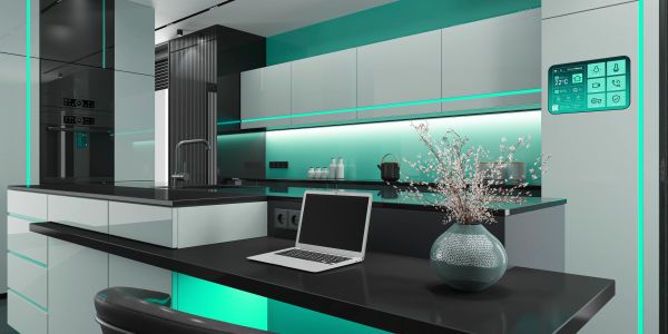 Modern kitchen with teal lighting and smart technology.