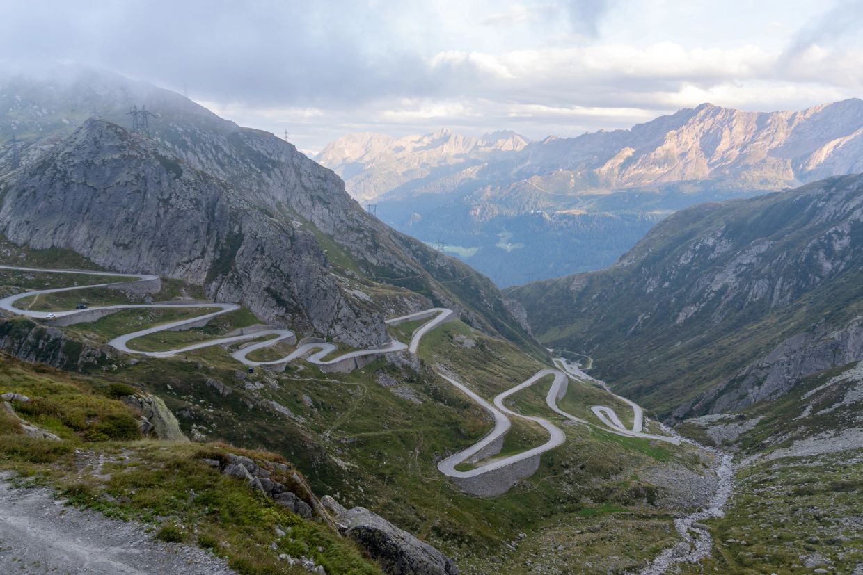 Winding mountain road with scenic views.