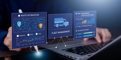 Digital interface showing fleet management and route optimization on a laptop.