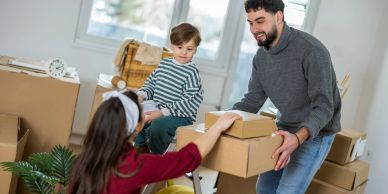 Family unpacking boxes in a new home.