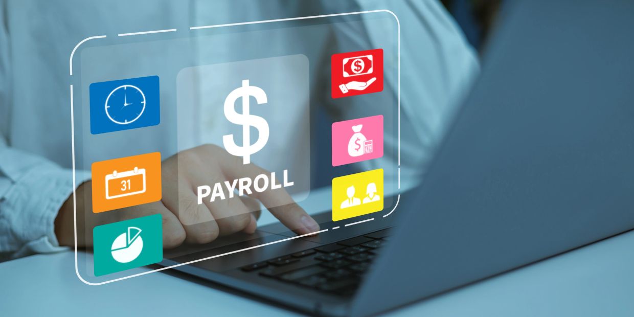 Person accessing payroll system on laptop.