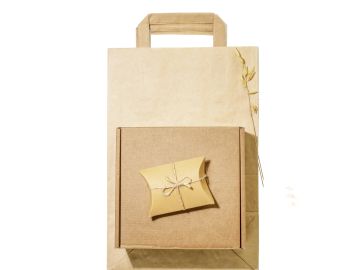 Eco-friendly brown paper gift packaging with a box and small envelope.