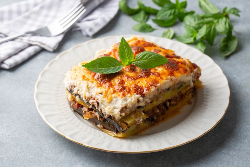 Traditional Greek potato and meat casserole with cheese - moussaka,