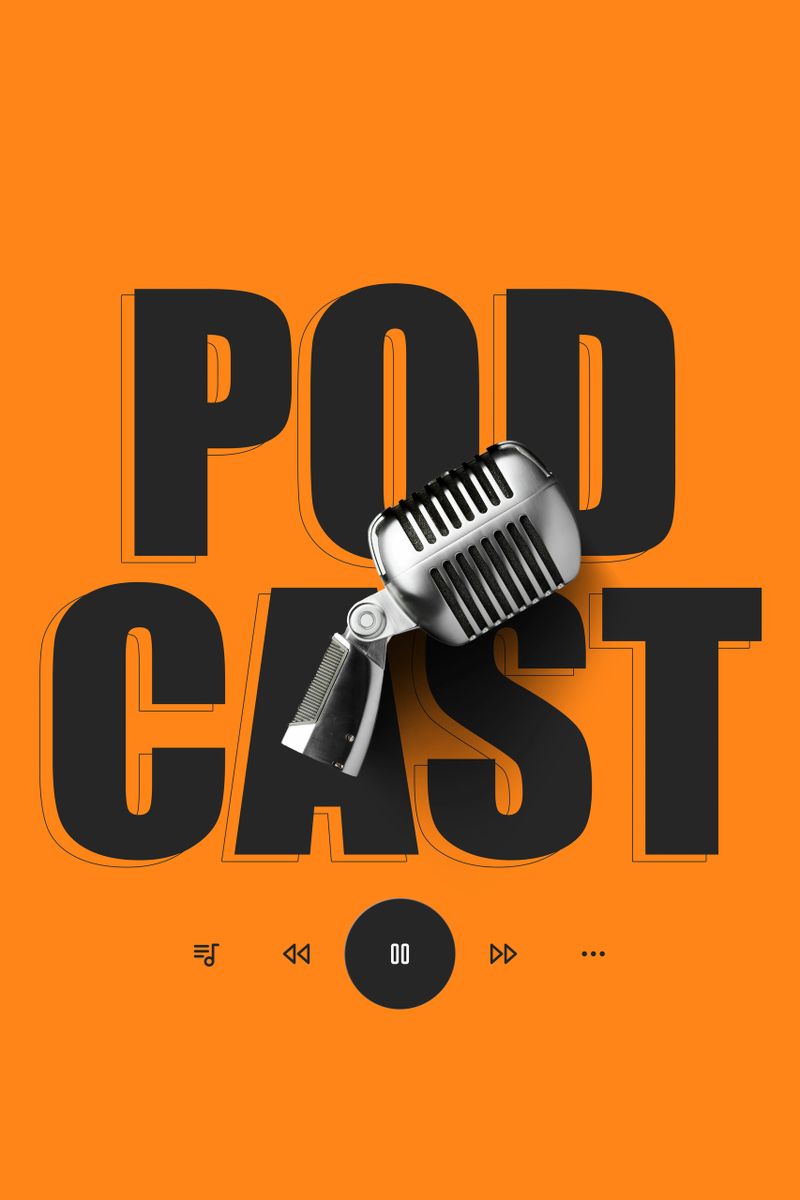 A microphone rests on an orange surface with the word podcast displayed prominently behind it.