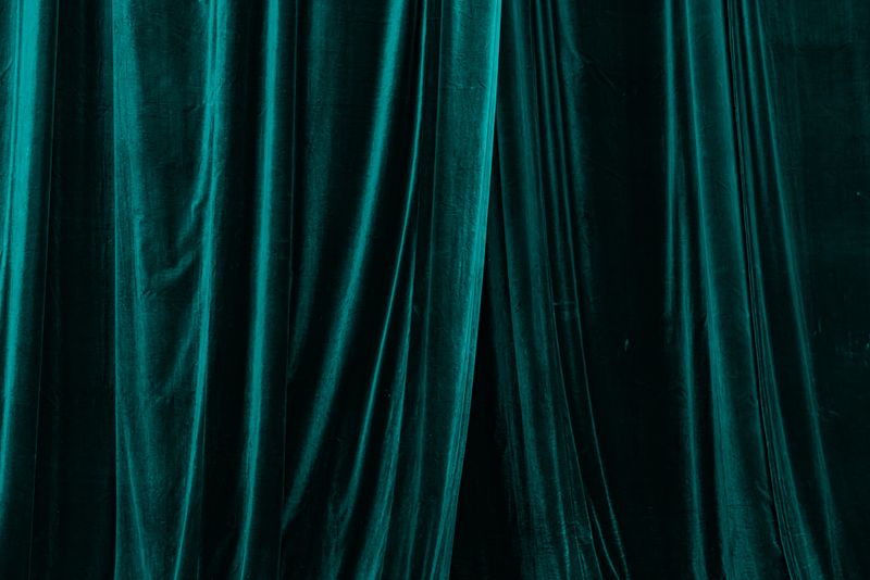 Texture of Luxury Dark Teal Velvet Curtains with Vertical Folds