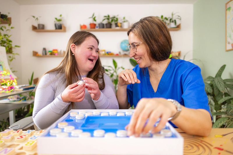 Young woman working at a learning center as an instructor for people with neurodiversity