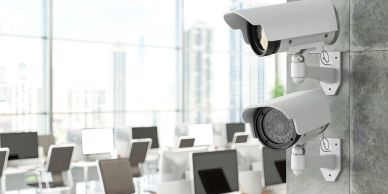 Security cameras mounted indoors in an office.