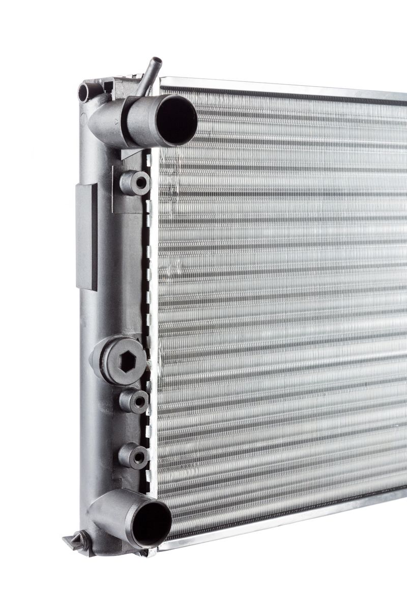 part of new car radiator from the side on white background