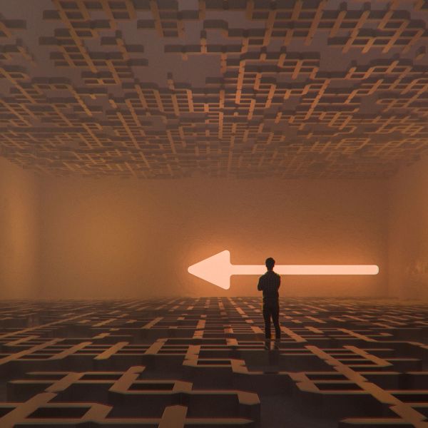 Person facing a large glowing left arrow in an abstract maze-like room.