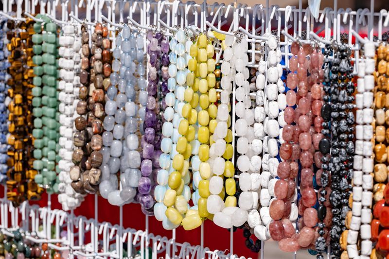 Various mineral bead necklaces showcasing a wide range of colors and textures for jewelry