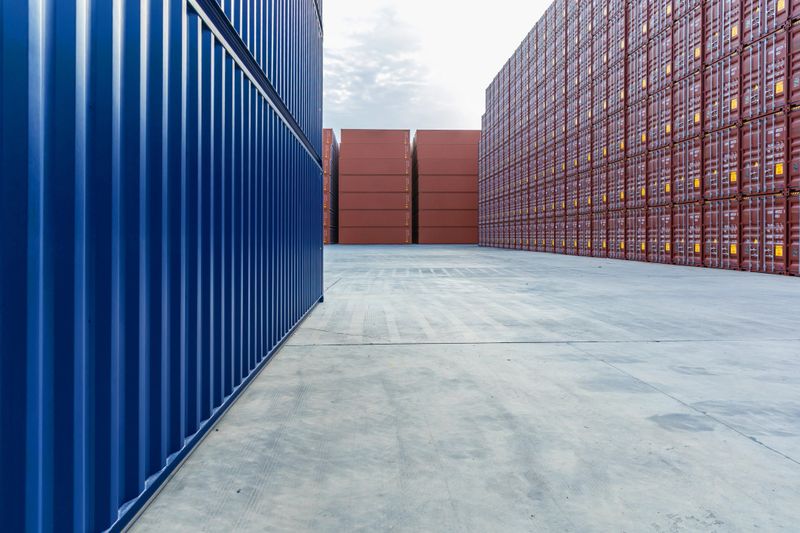 Containers stacked on the open ground of the dock