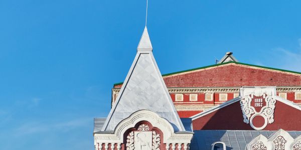 Architectural steeple against a clear blue sky.