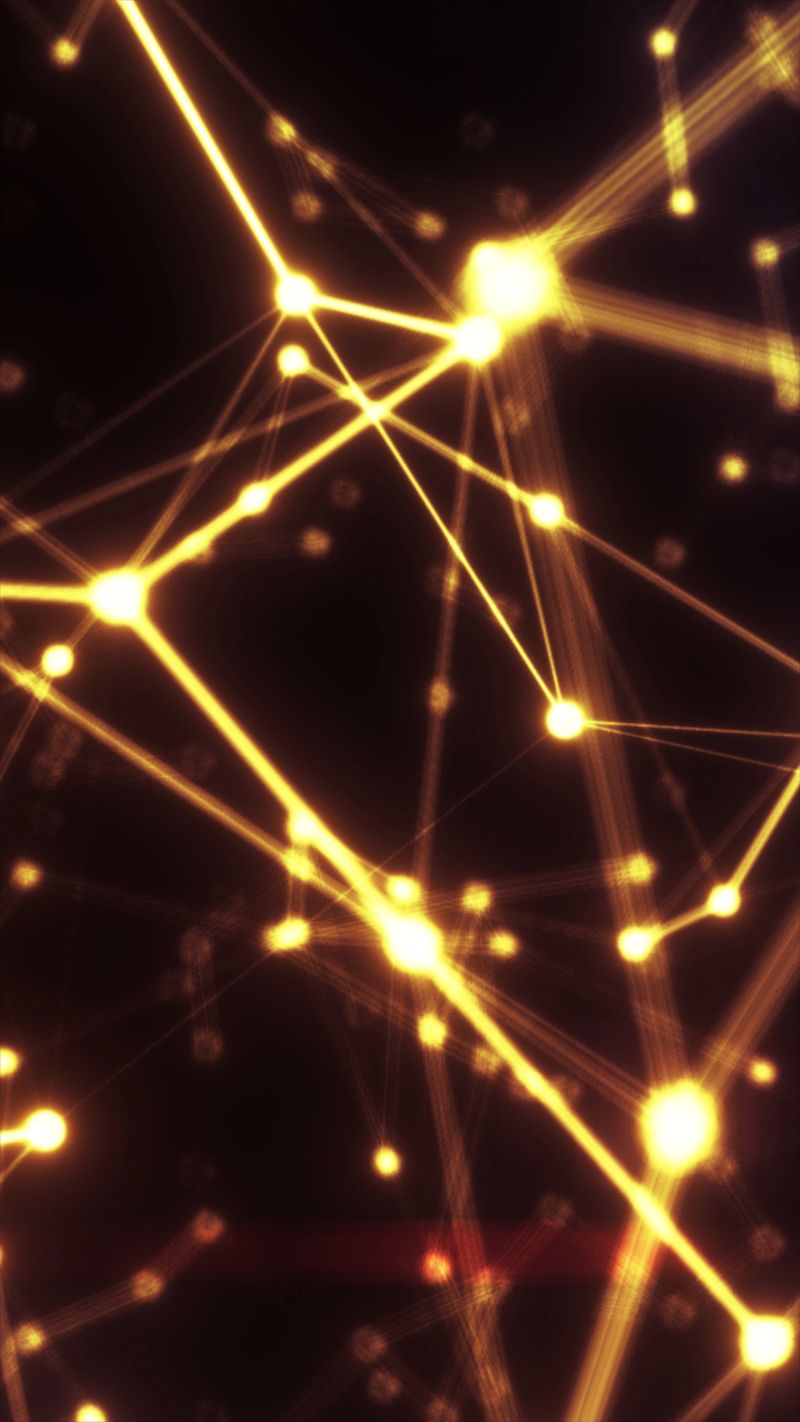 Abstract golden network of glowing nodes and connecting lines on a dark background, symbolizing data flow, digital connectivity, and futuristic technology systems.