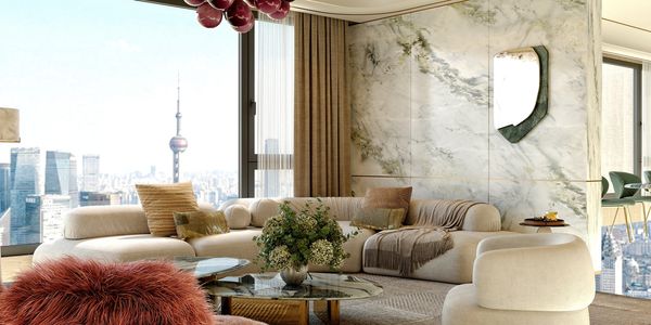 Elegant living room with city skyline view and modern decor.