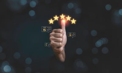 Thumbs up with glowing five-star rating and customer reviews.