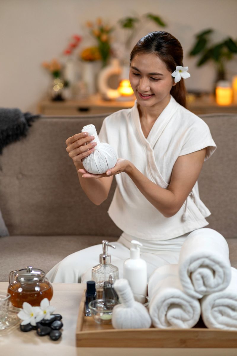 Relaxed Asian woman demonstrates ancient herbal compress technique for luxurious spa therapy at home promoting deep wellness and tranquility