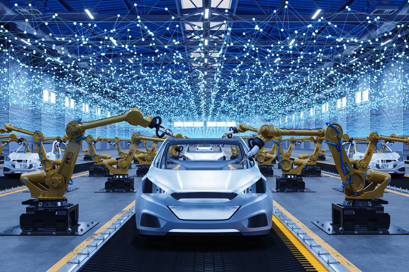Robotic Arms Assembling Electric Car Body on Smart Factory Production Line with Digital Network