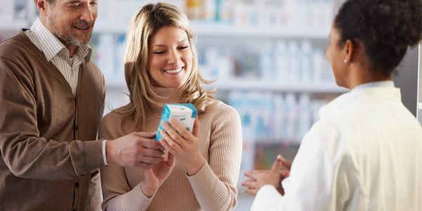 Couple shopping with pharmacist.