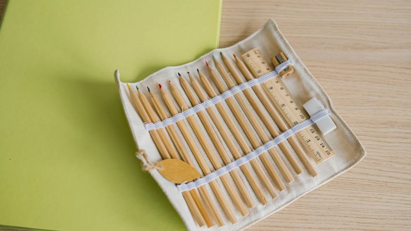 Eco-friendly pencil set with ruler on wooden desk.