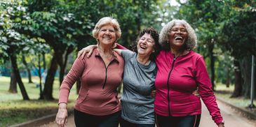 Elderly women happily taking a walk