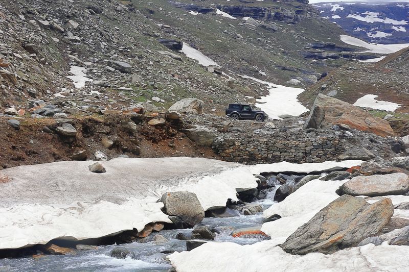 beautiful but dangerous himalayan mountain road of lahaul valley in himachal pradesh, india. epic road trips across the himalayas for adventure