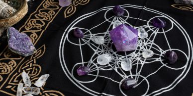 Tarot cards and runes on a wooden table.