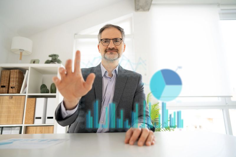 Businessman interacts with a futuristic virtual screen to analyze complex data and insights.