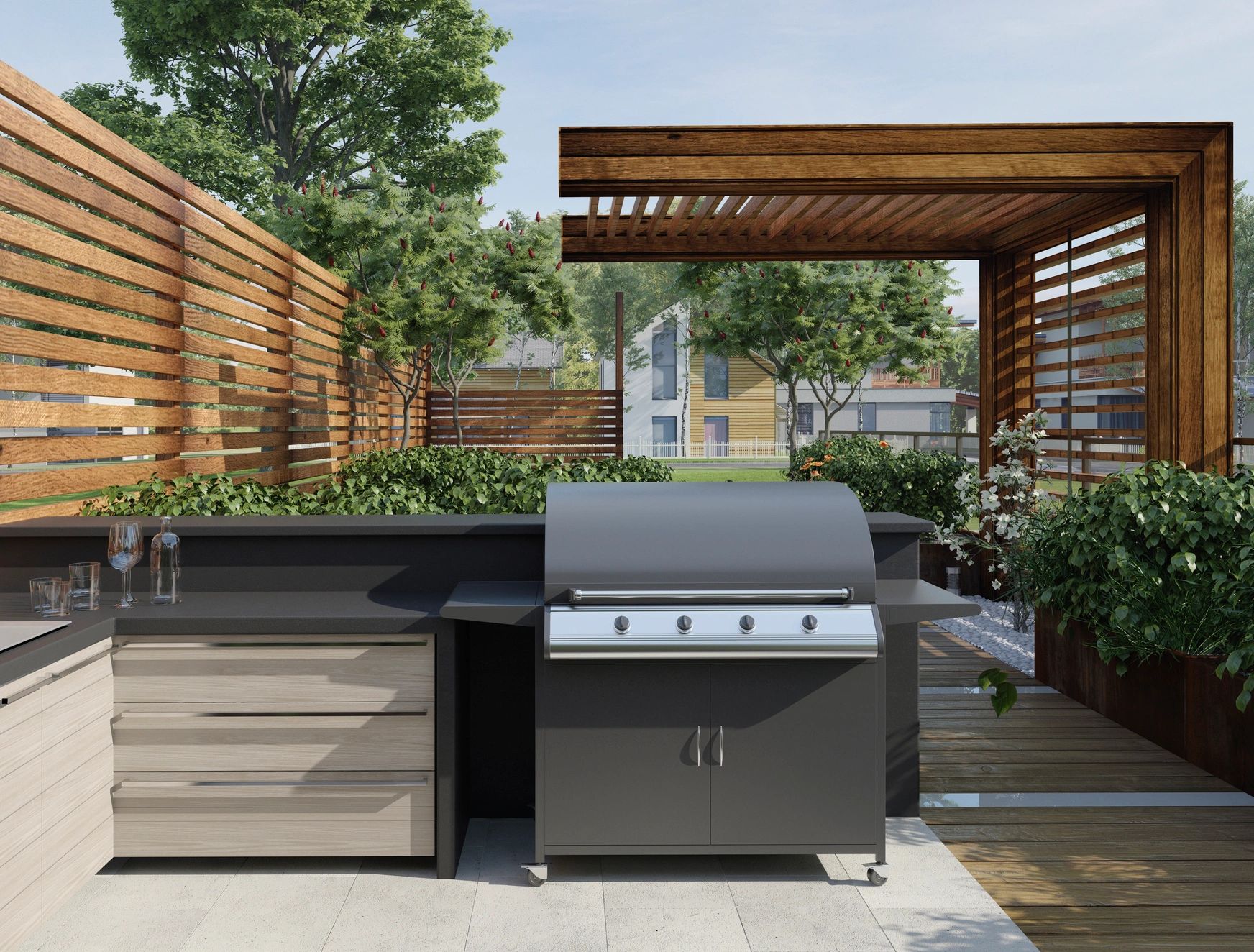 Modern outdoor kitchen with a grill and wooden pergola.