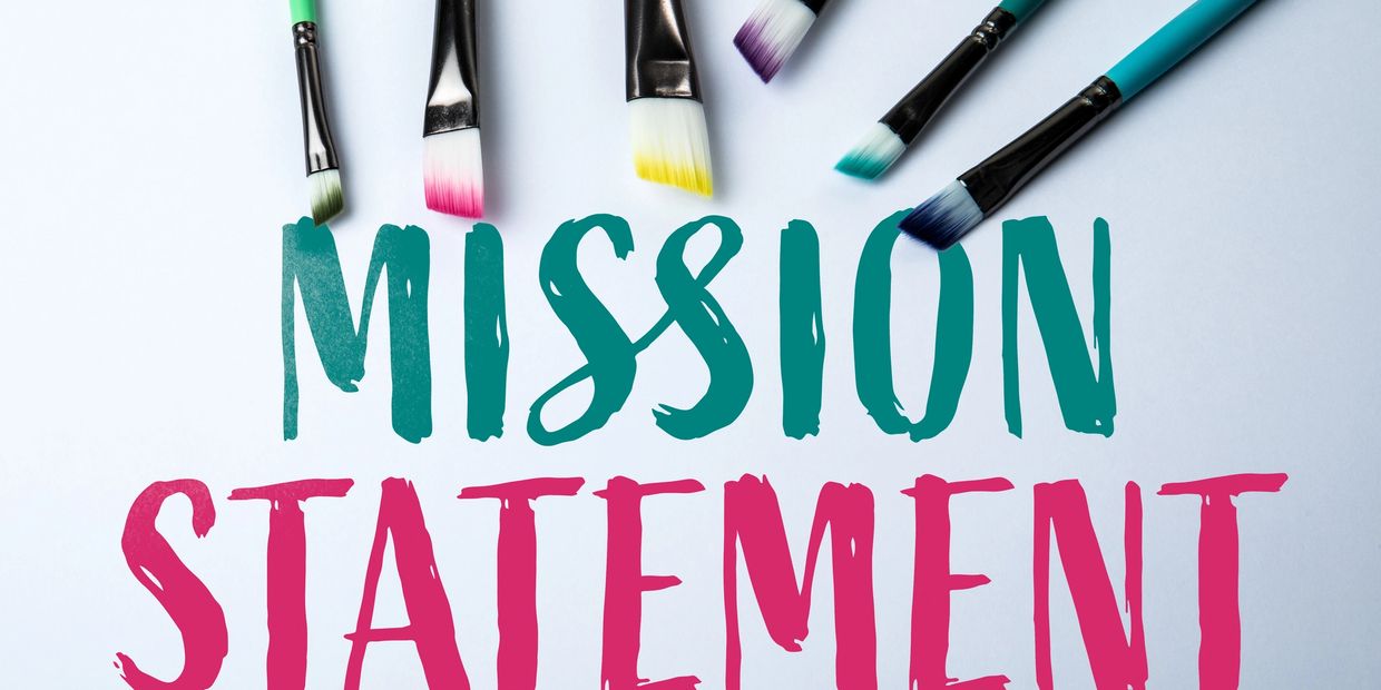 Colorful paintbrushes above the words 'MISSION STATEMENT' on a white background.