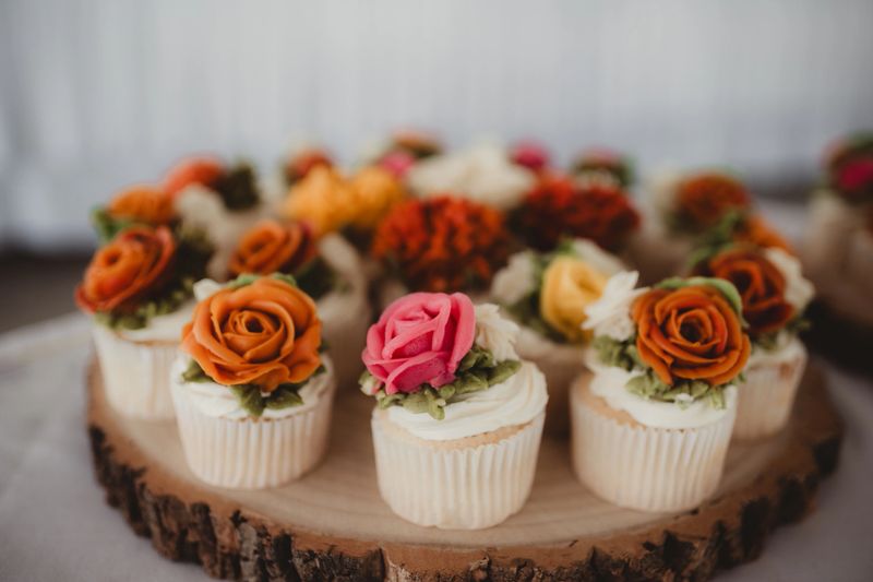 Vanilla wedding cupcakes with flower icing decorations