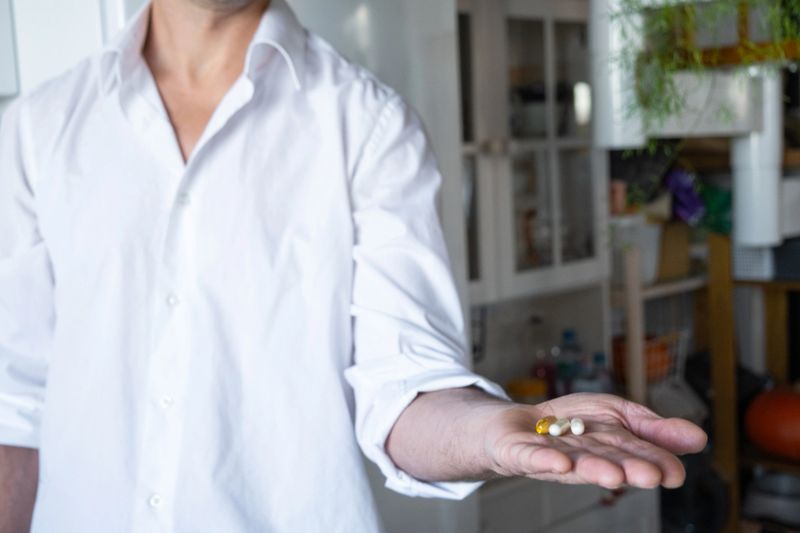 Man taking vitamins, male health, dietary supplements for men, immunity boosting, vitamins for energy, ad for vitamin brands, pharmacy promo