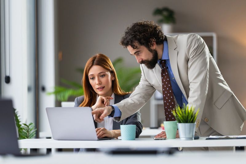 HR consultant guiding a manager through workforce strategy