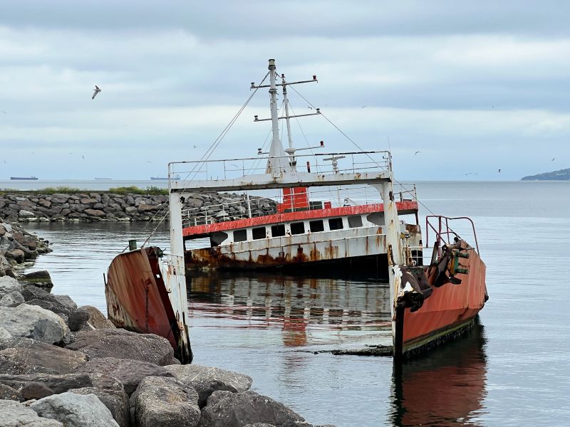 Partially sunken and rusted roro ship